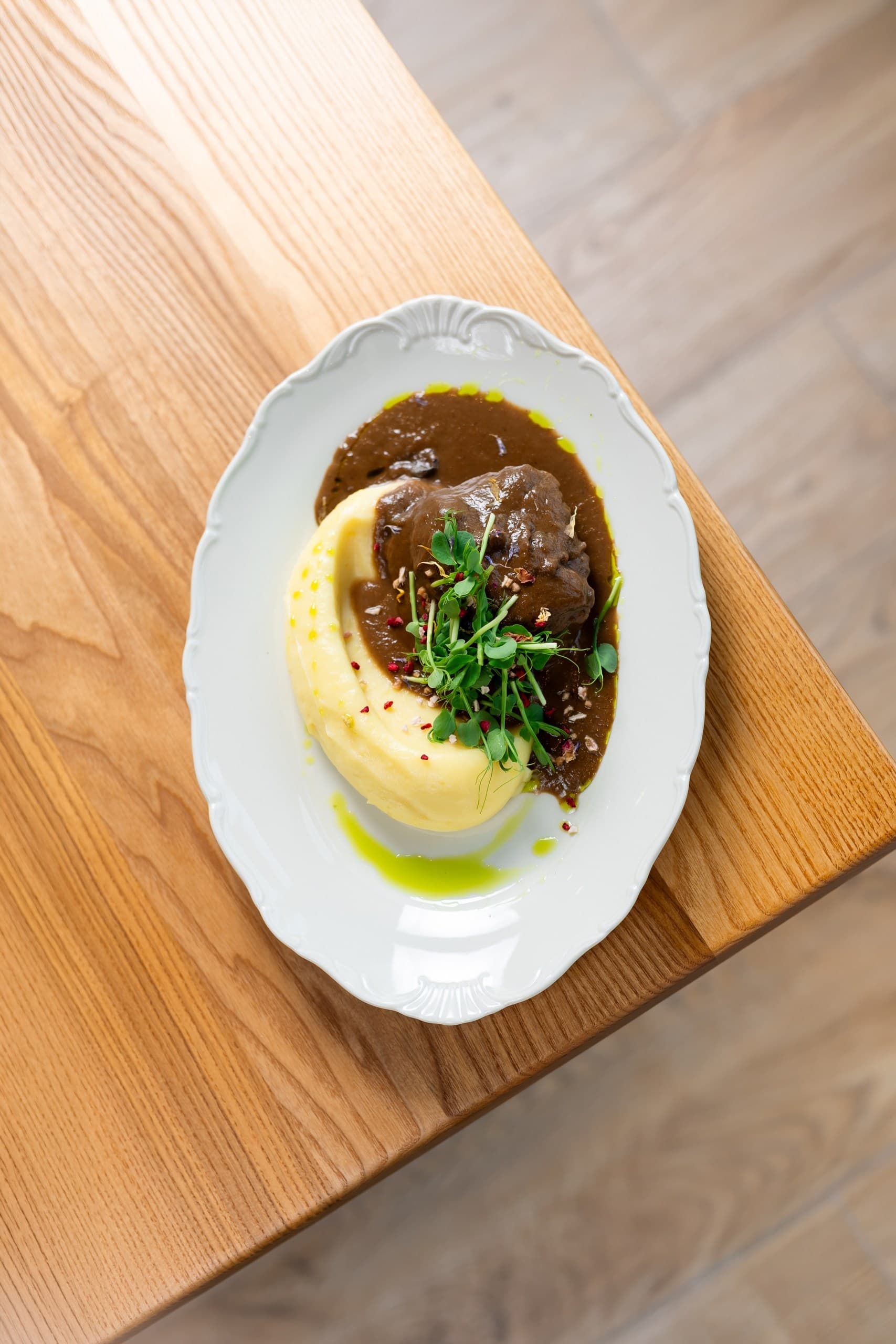 Warm BLIZKO dish on wooden table
